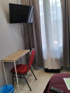 TV/trung tâm giải trí tại Hôtel Claridge's