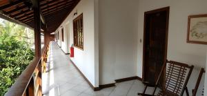 an empty hallway of a house with a door at Pousada Agua Viva in Abraão