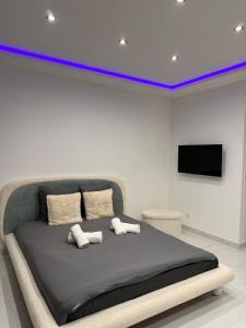 En eller flere senge i et værelse på Appartement T3 Haut Standing