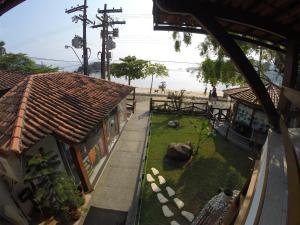 a view from the window of a building with a yard at Pousada Agua Viva in Abraão