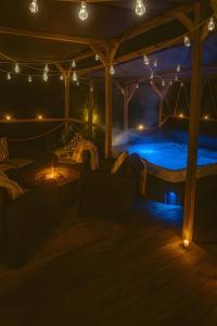 a room with a bed and lights in it at Evergreen -Ocean and Spa- in Parentis-en-Born
