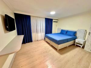 Giường trong phòng chung tại Golden Taksim Kent Apart Hotel