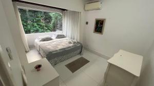 Giường trong phòng chung tại Casa Loboa individual perto do centro +46 ảnh