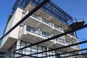 a building in front of a blue sky at Hotel Kochana in Chʼkhorotsqu