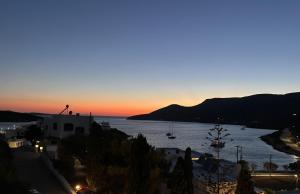 a view of a body of water at sunset at Vivazoi Ousia studio # 3 in Leipsoi +1 photo