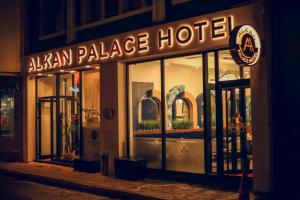 aahuan palace hotel is lit up at night at Alkan Palace Hotel in Kesan