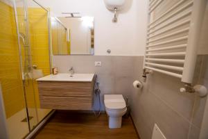 a bathroom with a toilet and a sink and a mirror at B&B Anele in Morano Calabro +17 photos
