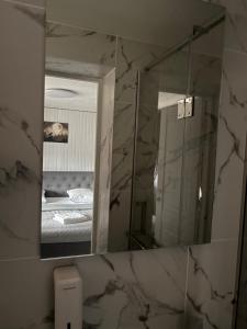 a mirror over a sink in a bathroom at Svitlyachok in Yaremche +75 photos