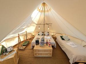 En eller flere senge i et værelse på I Giardini del Caramante