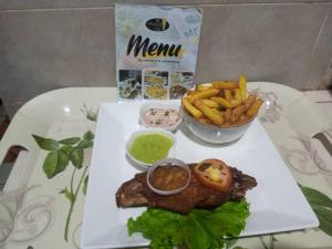 a white tray with a plate of food with french fries at MONIQUE CZ Maria Gléta in Abomey-Calavi +13 photos