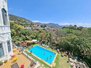 an overhead view of a swimming pool in a resort at Castelo dos Tucanos Host in Rio de Janeiro +34 photos