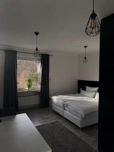 Ένα ή περισσότερα κρεβάτια σε δωμάτιο στο Studio am Waldrand