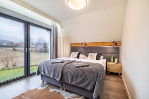 Giường trong phòng chung tại JAMILO Home