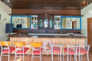 a bar with a bunch of chairs in front of it at Chomu Bagh Hotel & Resorts in Chomu in Jaipur