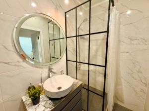 a bathroom with a sink and a mirror at ЖК Абая 5 in Kokshetau