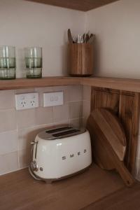 a toaster sitting on top of a kitchen counter at Gills in Murdunna