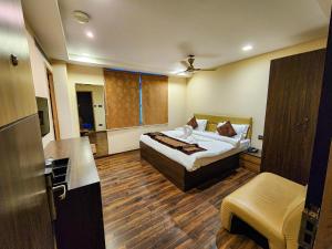 En eller flere senge i et værelse på Arcadian Hotel