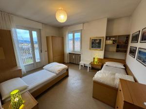 En eller flere senge i et værelse på A Due Passi dalle Piste