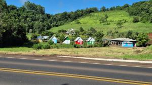 a row of houses on the side of a road at Pousada Gaúcha Caibi in São Domingos +7 photos