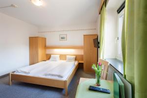 Letto o letti in una camera di Hotel Linde