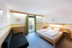 Letto o letti in una camera di Hotel Linde