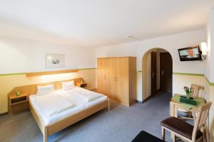 Letto o letti in una camera di Hotel Linde