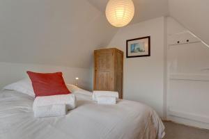 En eller flere senge i et værelse på Cley Corner Cottage