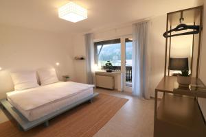 En eller flere senge i et værelse på Eifel17 plus 6 - Japandi-Stay in der Vulkaneifel