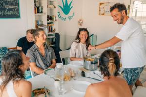 a group of people sitting around a table at Aloe Vera Shared House in El Médano