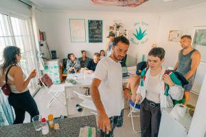 a group of people standing in a room at Aloe Vera Shared House in El Médano