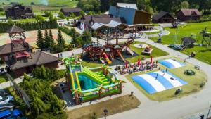 an aerial view of a playground with a water park at Tajný house in Stará Turá