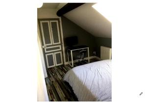 En eller flere senge i et værelse på Le Refuge des Bords de Loire