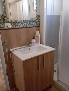 a bathroom with a white sink and a shower at Apartamento Bro Mar in Salou +20 photos