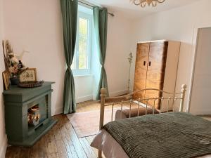 Postel nebo postele na pokoji v ubytování Gîte - Le Pied des Remparts
