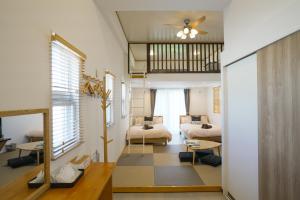 Postel nebo postele na pokoji v ubytování Villa Sunbeams ヴィラ・サンビームス + 58 fotografií