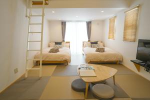 TV a/nebo společenská místnost v ubytování Villa Sunbeams ヴィラ・サンビームス