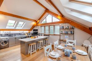 a kitchen and dining room with a table and chairs at 3 Bed in Croyde oc-t30753 in Croyde