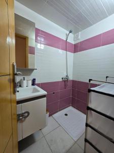 a bathroom with a tub and a sink and a shower at Luxury Fes Residence Appartement & Studio in Fès