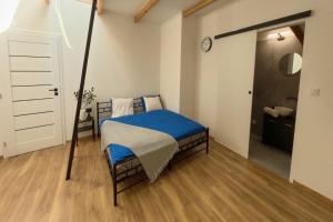 Ένα ή περισσότερα κρεβάτια σε δωμάτιο στο Centrum Rosenbaum