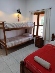 En eller flere senge i et værelse på Los Aromos Cafayate