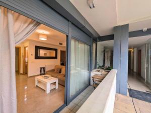 a view of a living room from the balcony of a house at Relax en Lloret con Gym y Piscina by Host&Joy in Lloret de Mar