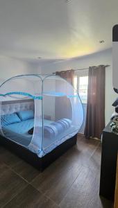 Giường trong phòng chung tại GREEN House