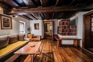 a living room with a couch and a table at Traditional Slovenian House Pr'Belej in Zgornje Gorje