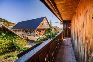 an exterior view of a wooden balcony of a house at Traditional Slovenian House Pr'Belej in Zgornje Gorje