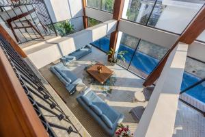 an overhead view of a house with a pool at Valley View 5-BHK Villa With Private Pool, Sit-out Areas, TT Table, Pool Table , Bar & Scenic Views in Mapusa