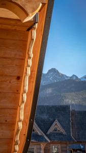 a view of the mountains from the window of a cabin at Apartamenty Premium Rysulówka in Kościelisko +108 photos
