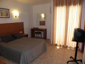 Postel nebo postele na pokoji v ubytování Hotel Jardín