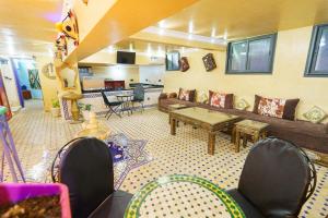 a living room with a couch and a table at Laghrib Hostel in Tangier
