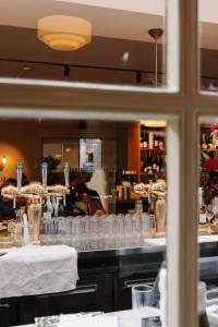 a reflection of a restaurant counter with glasses at Metzlr House in Haarlem