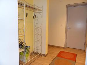 a room with a closet with a mirror and a door at Ferienwohnung Paula in Lichtenstein